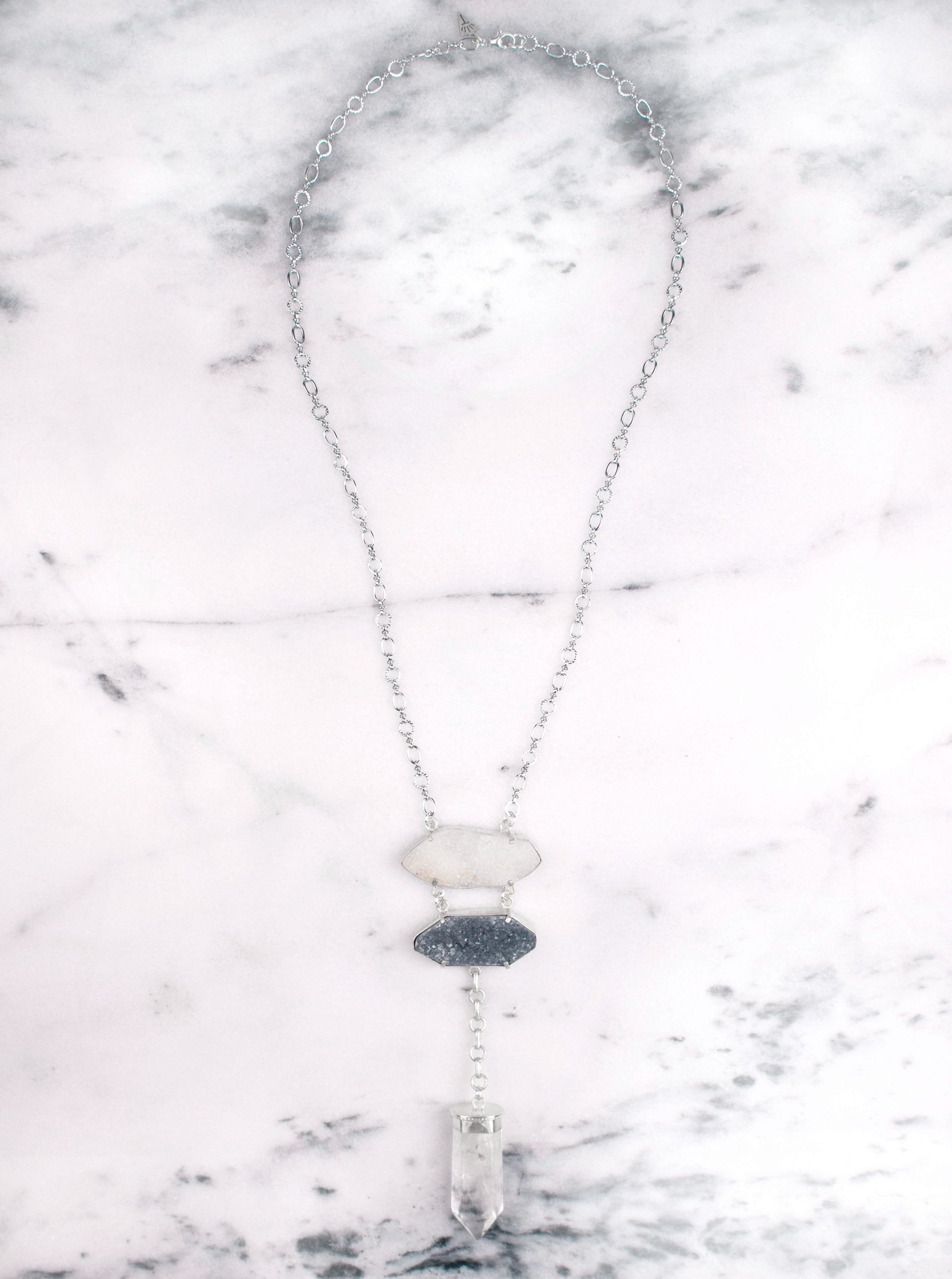 A One of a Kind Statement Necklace featuring Quartz Crystals set in Sterling Silver, handmade by Tribe Jewelry Designer Sarah Lewis.  