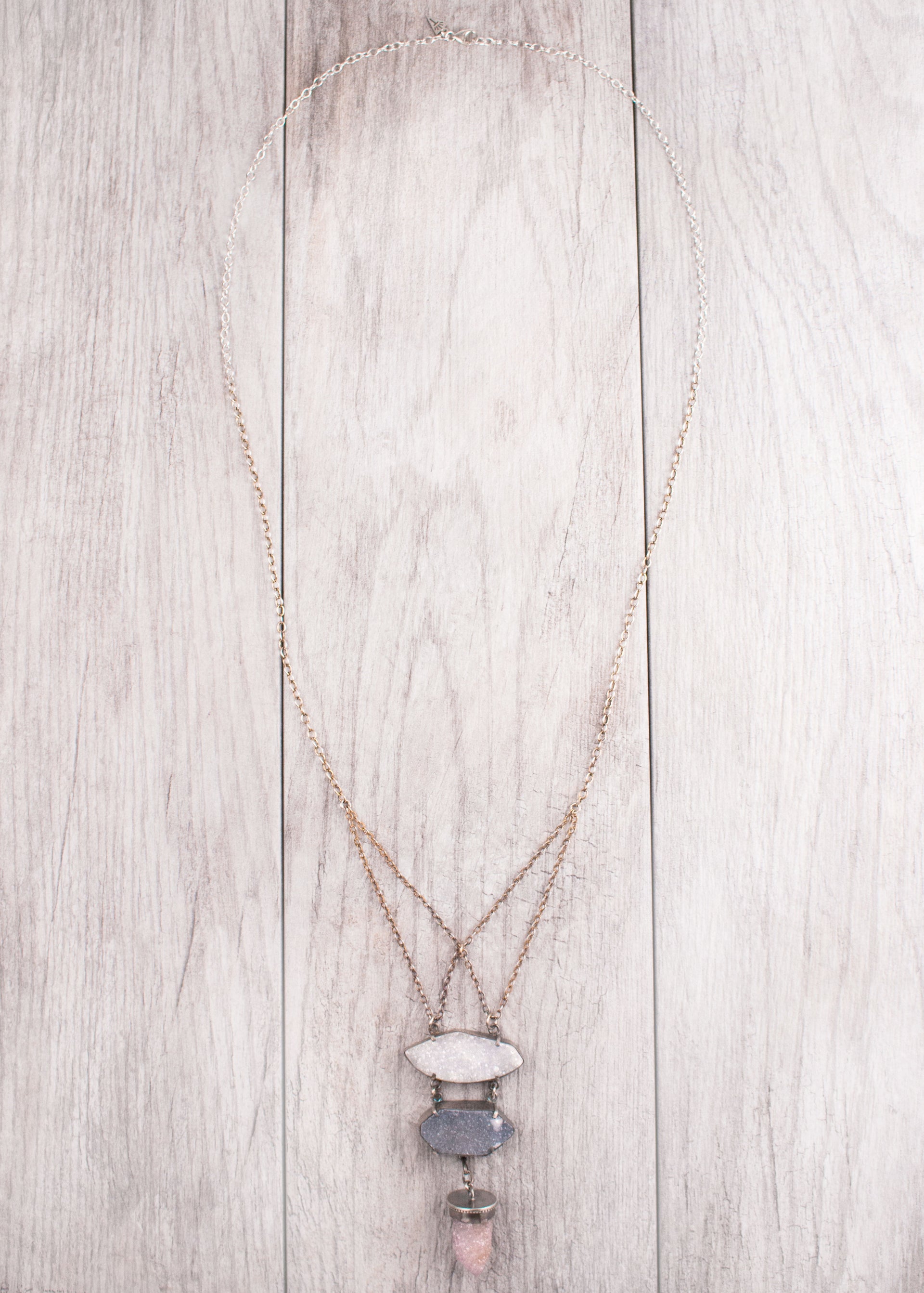 A One of a Kind Statement Necklace featuring a Drusy Quartz and Amethyst Spirit Quartz Crystals set in Oxidized Sterling Silver, handmade by Tribe Jewelry Designer Sarah Lewis.  