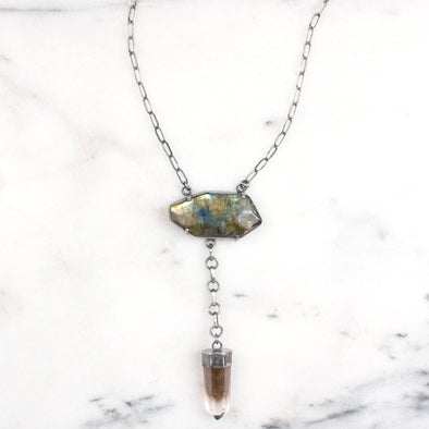 A One of a Kind Statement Necklace featuring a Labradorite and Smokey Quartz set in Oxidized Sterling Silver, handmade by Tribe Jewelry Designer Sarah Lewis.  