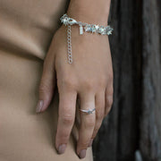 A bohemian style, silver plated stacking ring featuring a tiny star on a hammered band, by Tribe Jewelry Designer Sarah Lewis.