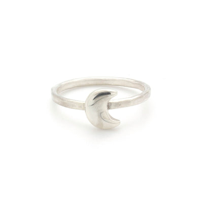 A bohemian style, silver plated stacking ring featuring a tiny crescent moon on a hammered band, by Tribe Jewelry Designer Sarah Lewis.