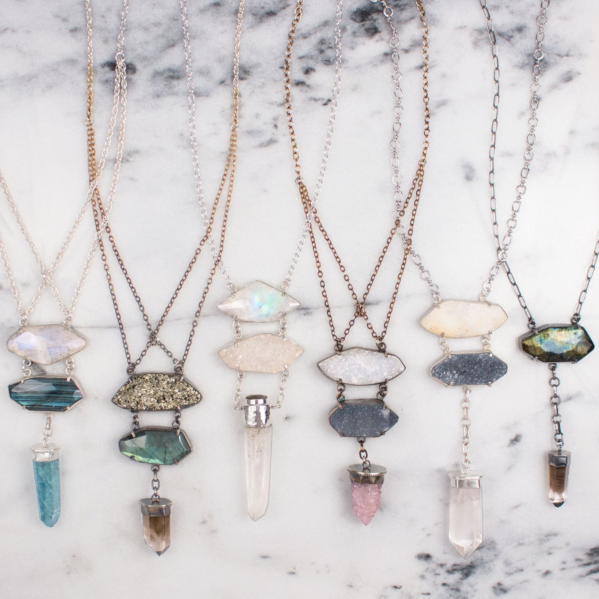 A One of a Kind Statement Necklace featuring a Drusy Quartz and Amethyst Spirit Quartz Crystals set in Oxidized Sterling Silver, handmade by Tribe Jewelry Designer Sarah Lewis.  