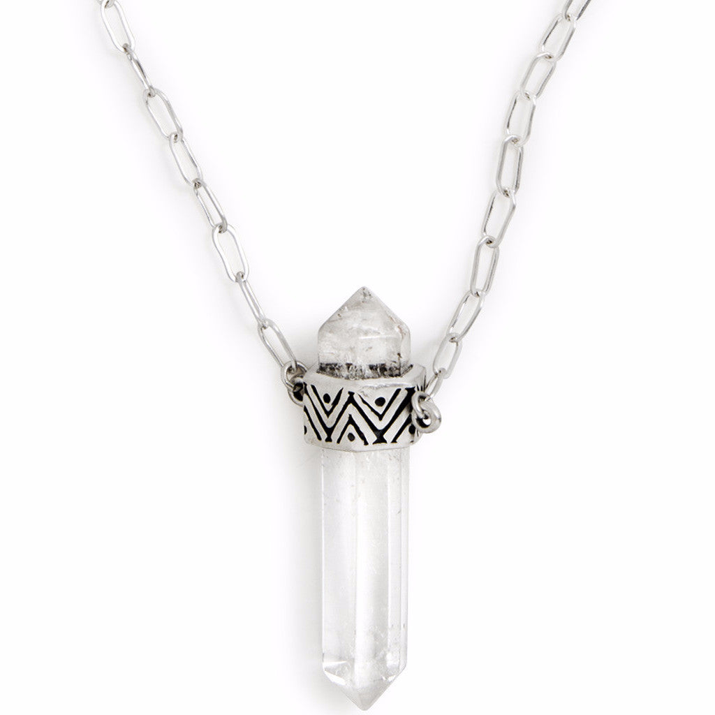 A Sterling Silver Necklace, featuring a Quartz Crystal Pendant with carved geometric pattern on setting.