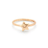 A bohemian style, gold plated stacking ring featuring a tiny star on a hammered band, by Tribe Jewelry Designer Sarah Lewis.