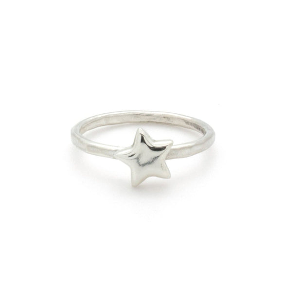 A bohemian style, silver plated stacking ring featuring a tiny star on a hammered band, by Tribe Jewelry Designer Sarah Lewis.