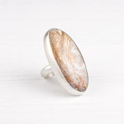 A Crazy lace agate cabochon set in sterling silver handmade by designer Sarah Lewis